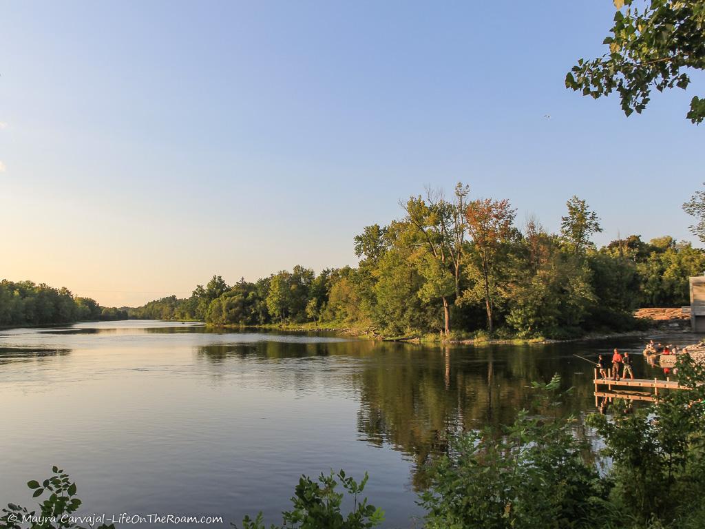 Sunset over a river and the river bank