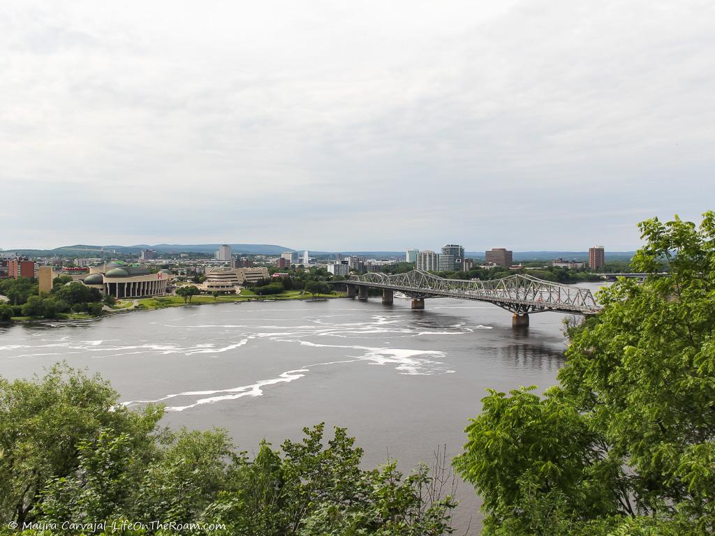 View of a river, a bridge and a shoreline from a higher perspective