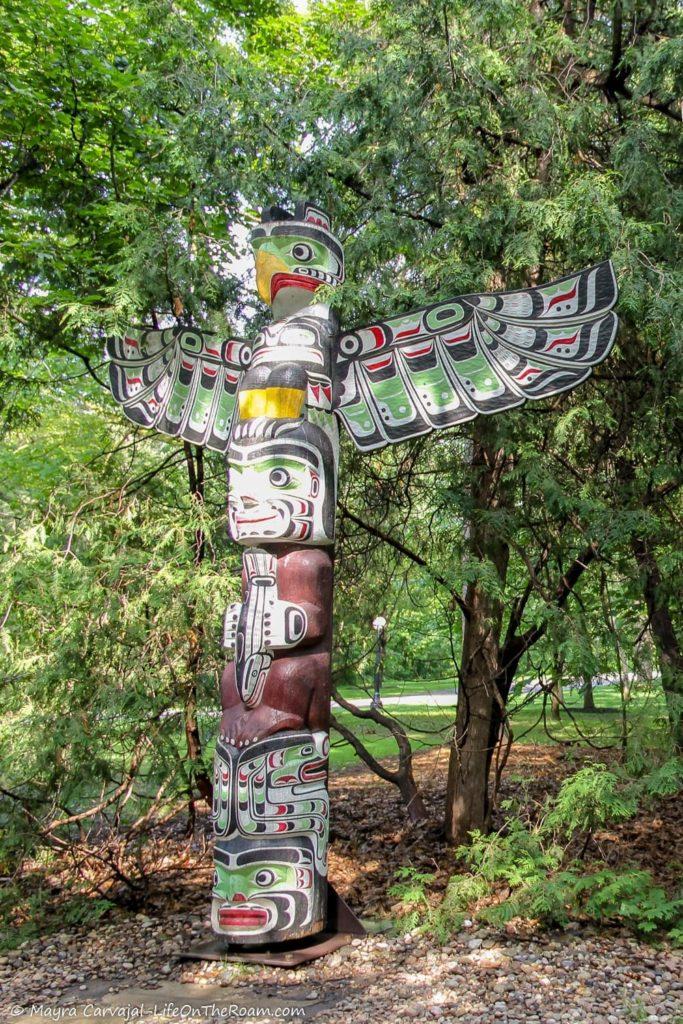 A totem pole in a garden