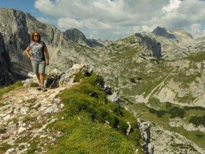 Me reaching a viewpoint of an impressive massif