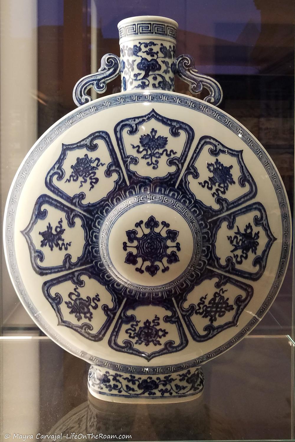 A moon-flask from China in white porcelain and delicate blue brushwork