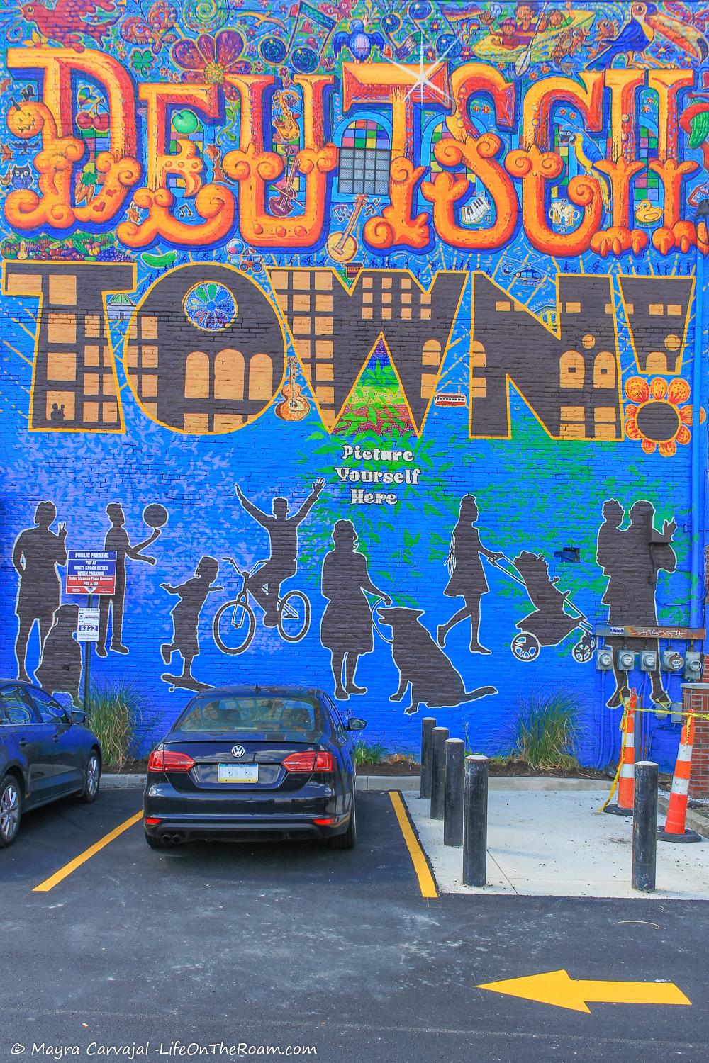 A colourful mural in the city featuring the lettering "Deutschtown"