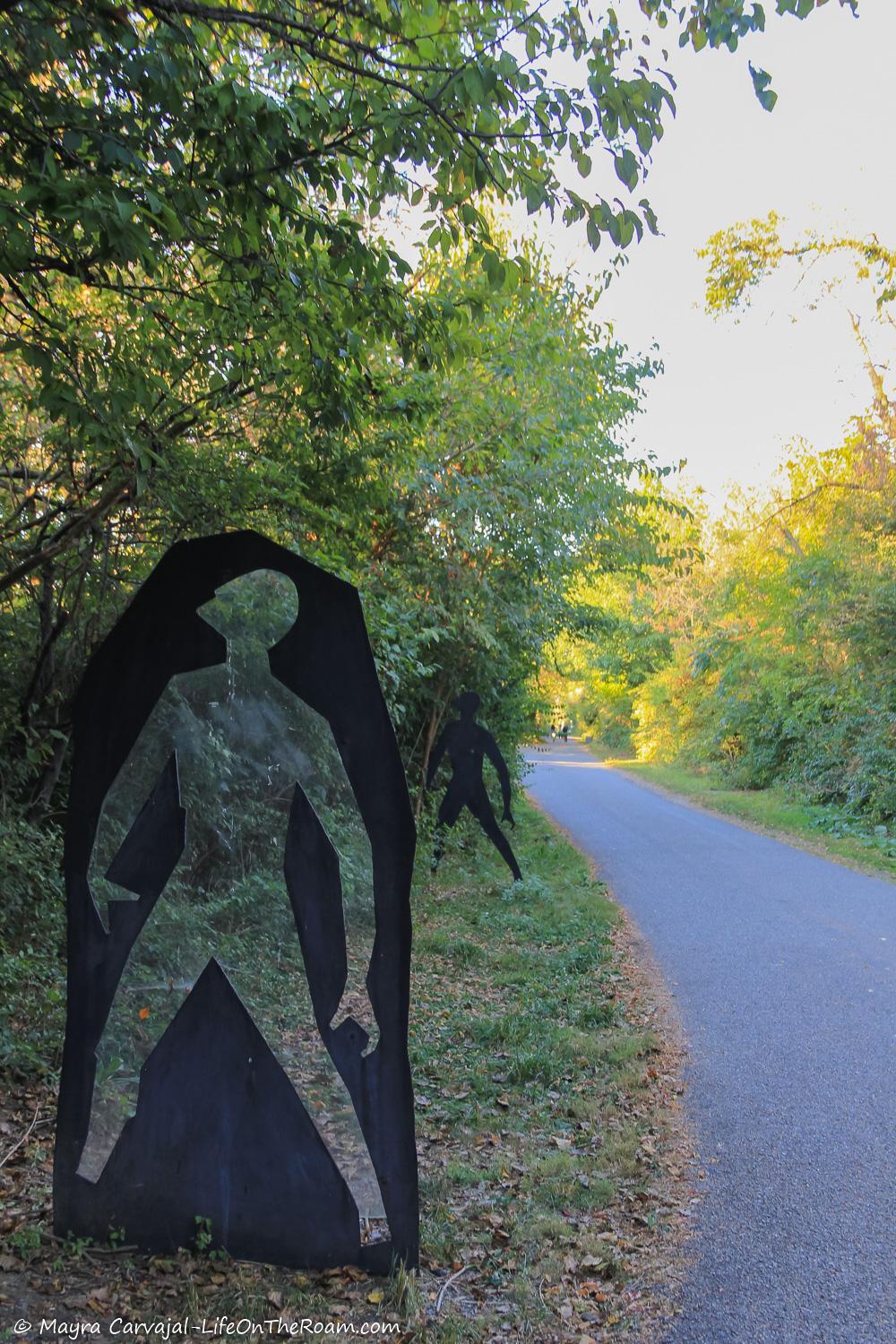 Outdoor art along a paved trail