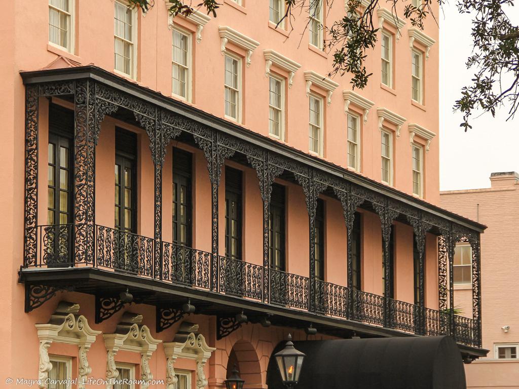 An ironwork balcony in a historic hotel