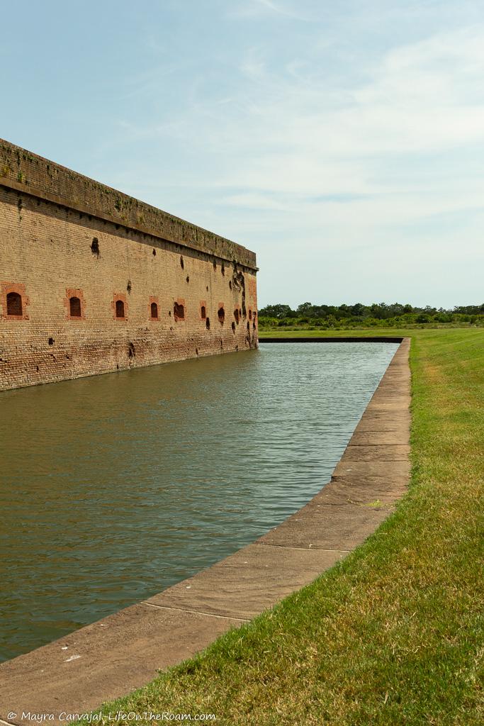 A historic fort with a moat