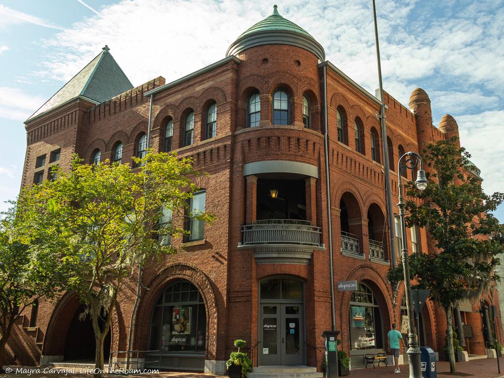 A brick historic building with many arches