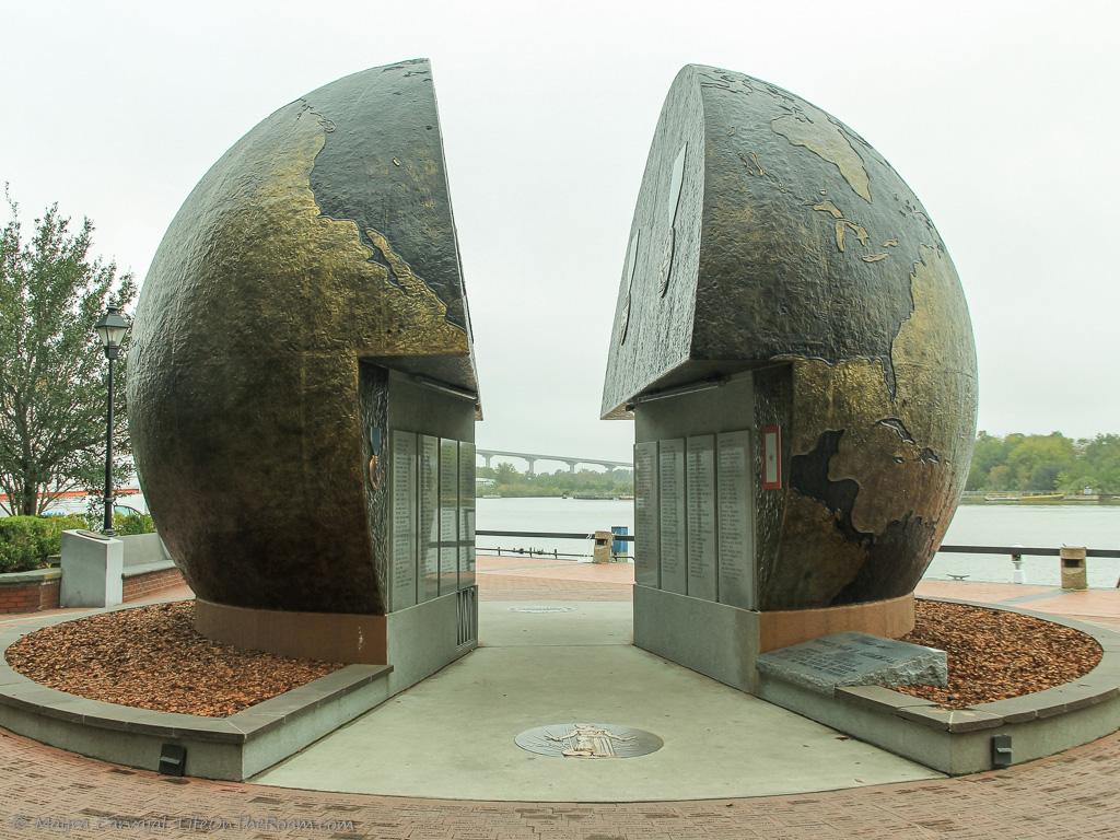 A large monument with a globe split in two