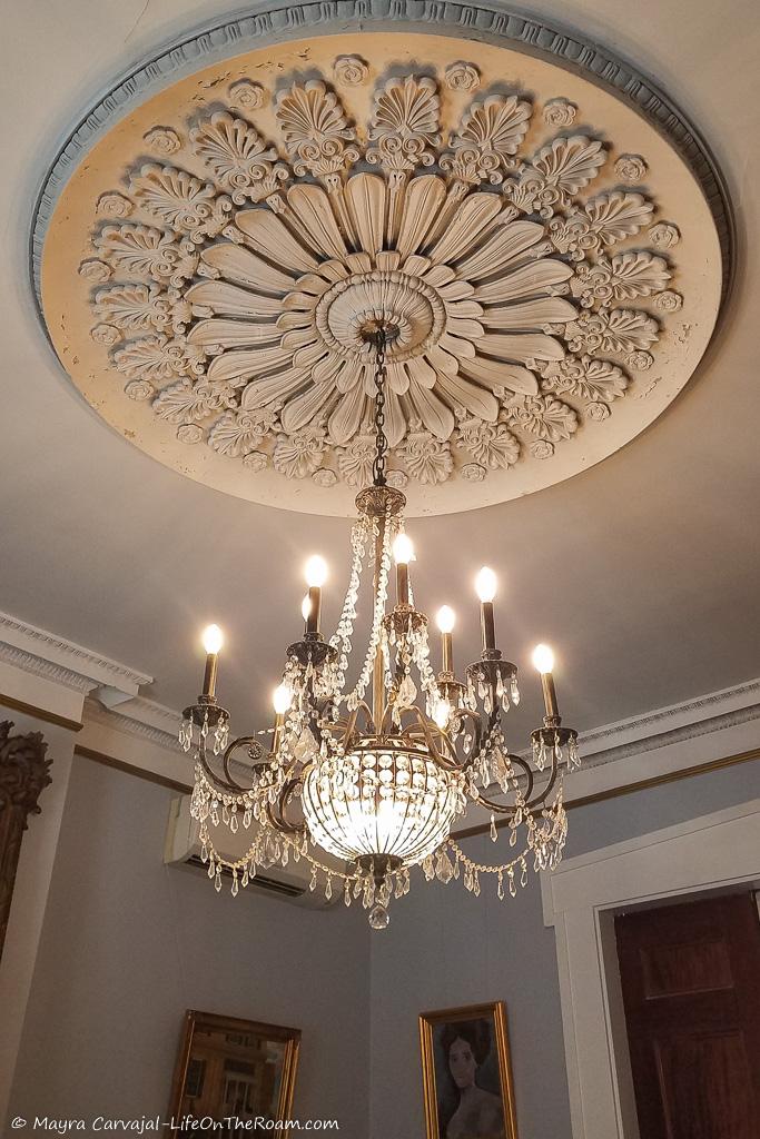 A ceiling medallion and a chandelier