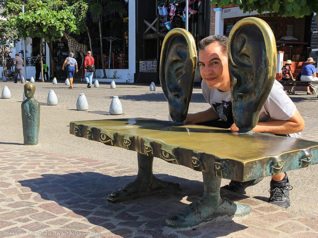 A quirky bronze sculpture that serves as a bench