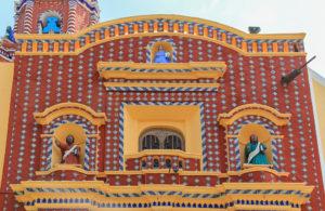 A colourful tiled facade of a church