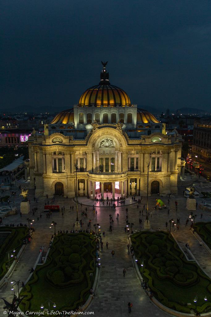 A stately building lit at dusk