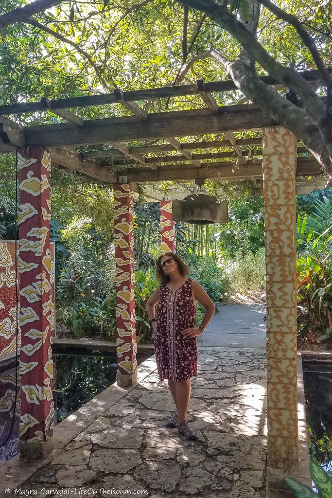 Mayra under a pergola with Asian motifs