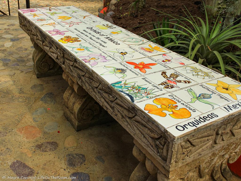 A tiled bench in a garden