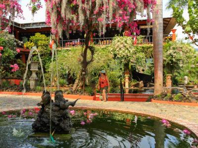 A bountiful garden with a fountain