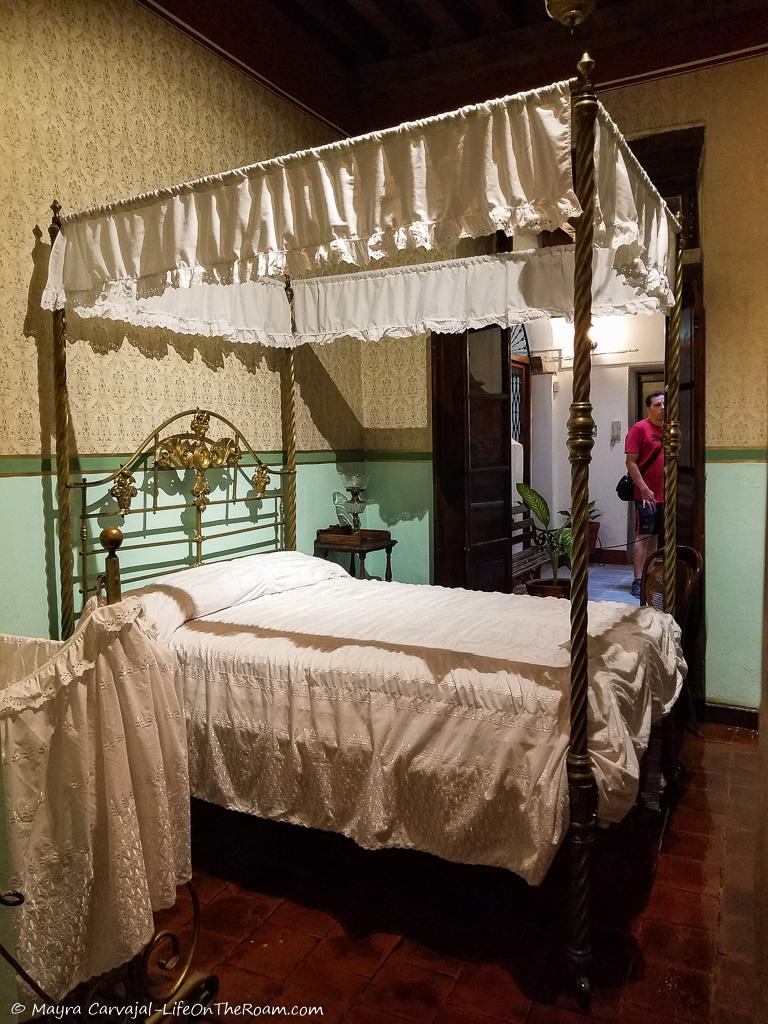 A bedroom with period furniture