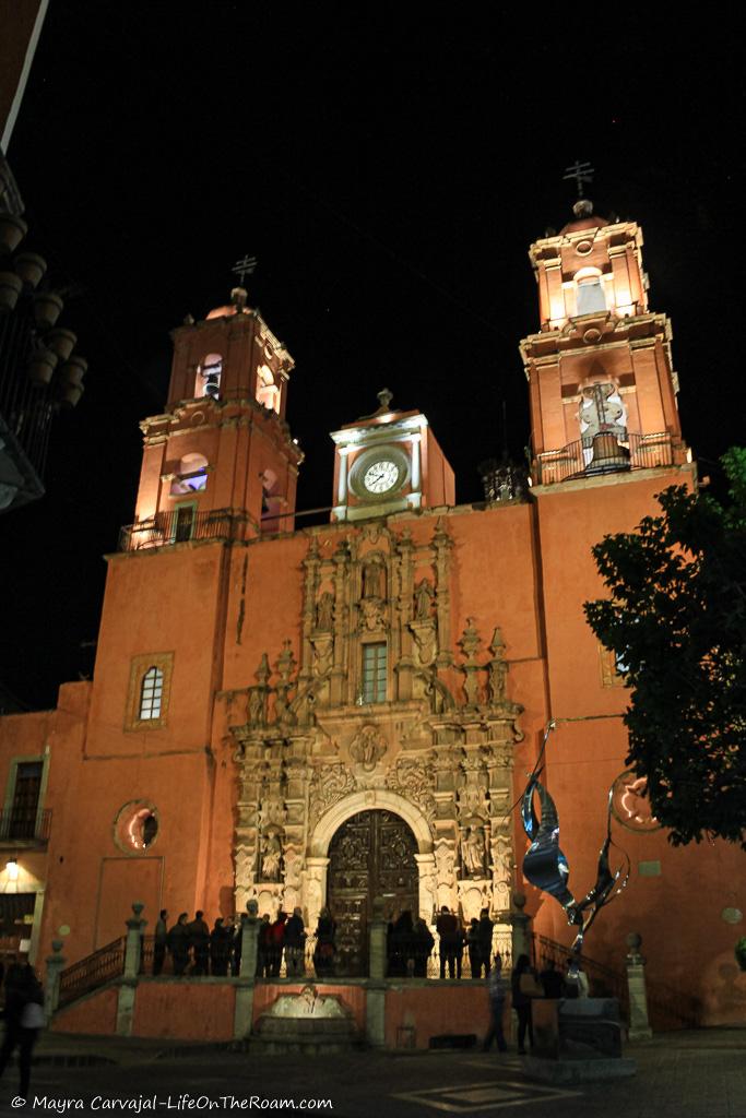 A historic church lit up at night