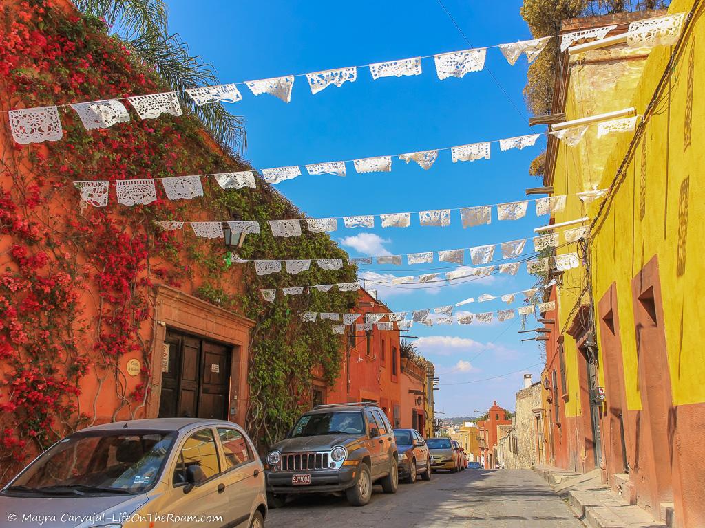 Colourful narrow streets leading to a church in the distance