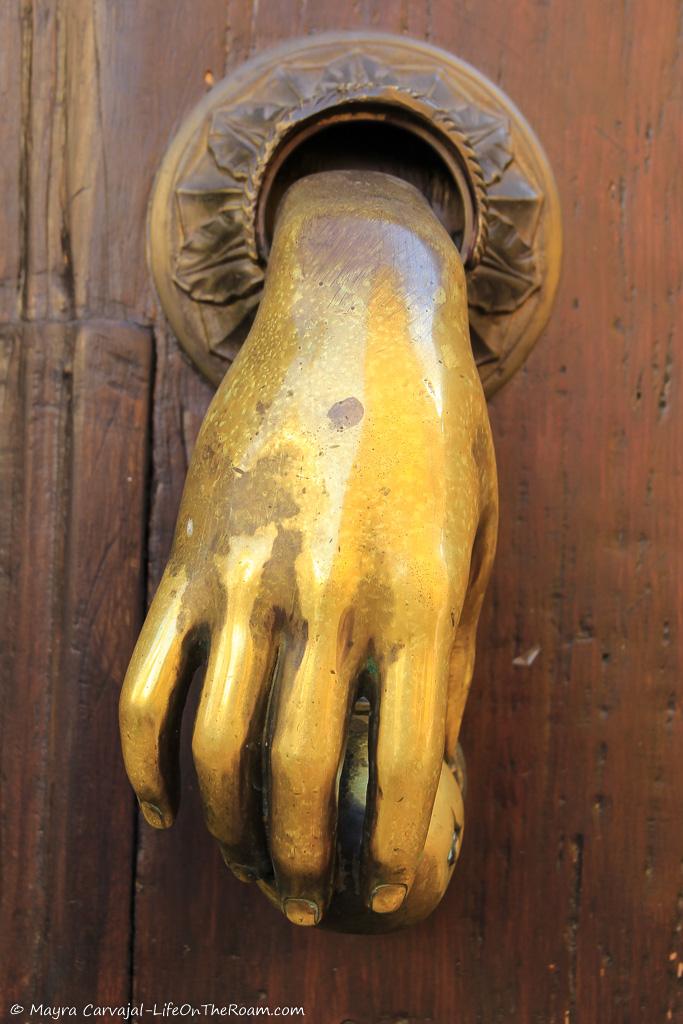An old door knocker in bronze