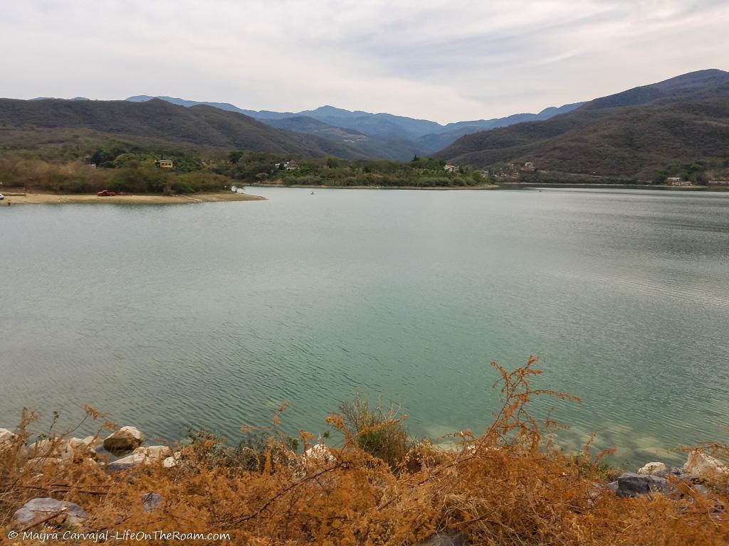 A water reservoir with mountains in the background