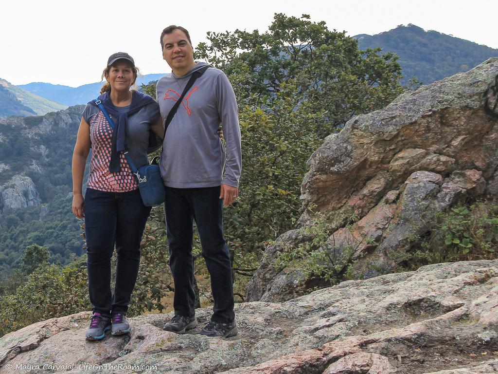 A couple with a mountain view in the background