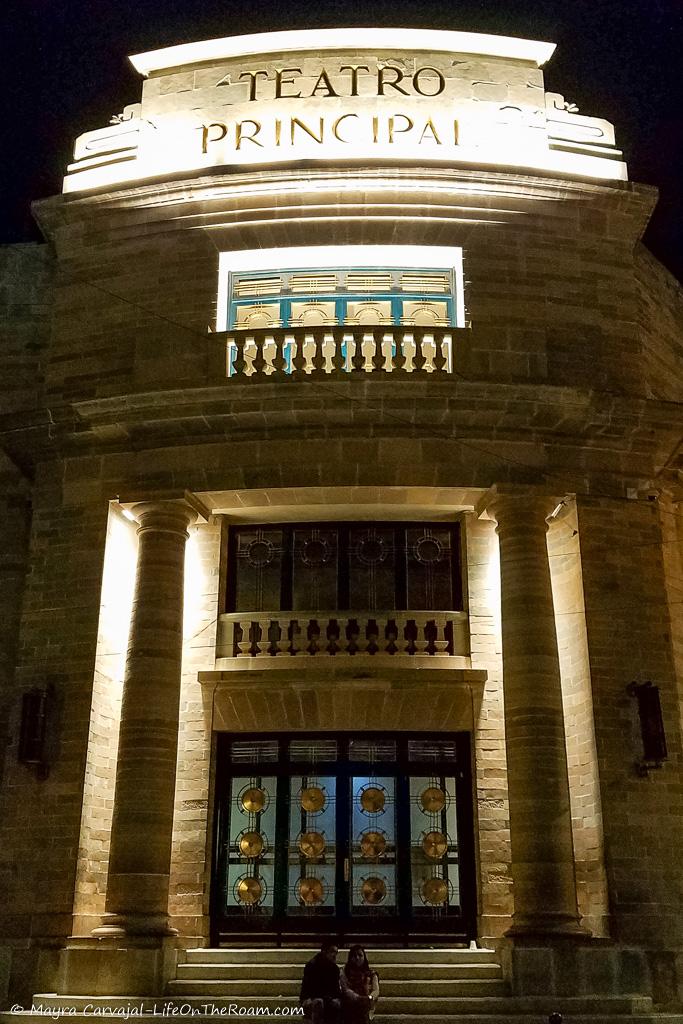 A historic building lit at night