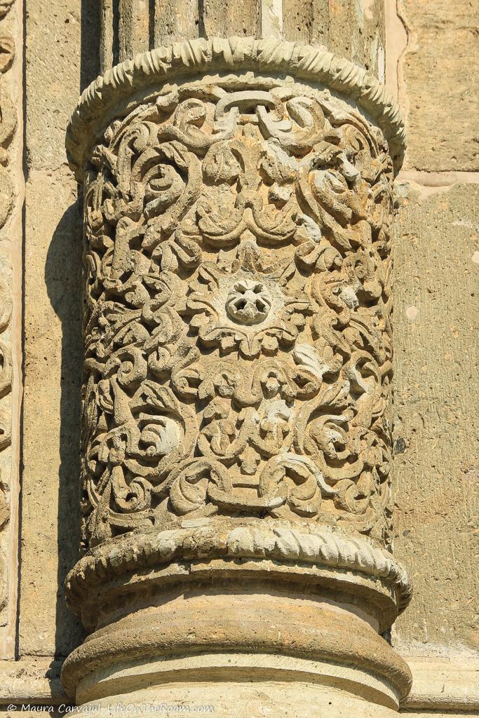 Carvings in a stone round column