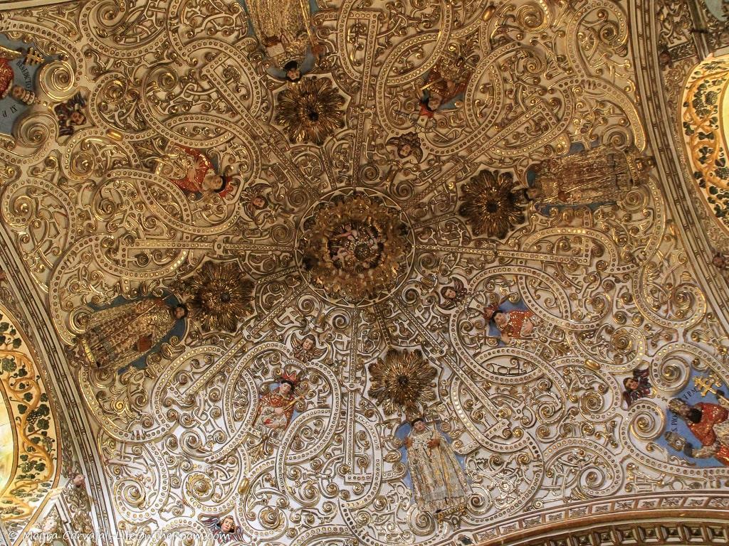 A heavily decorated ceiling in a church