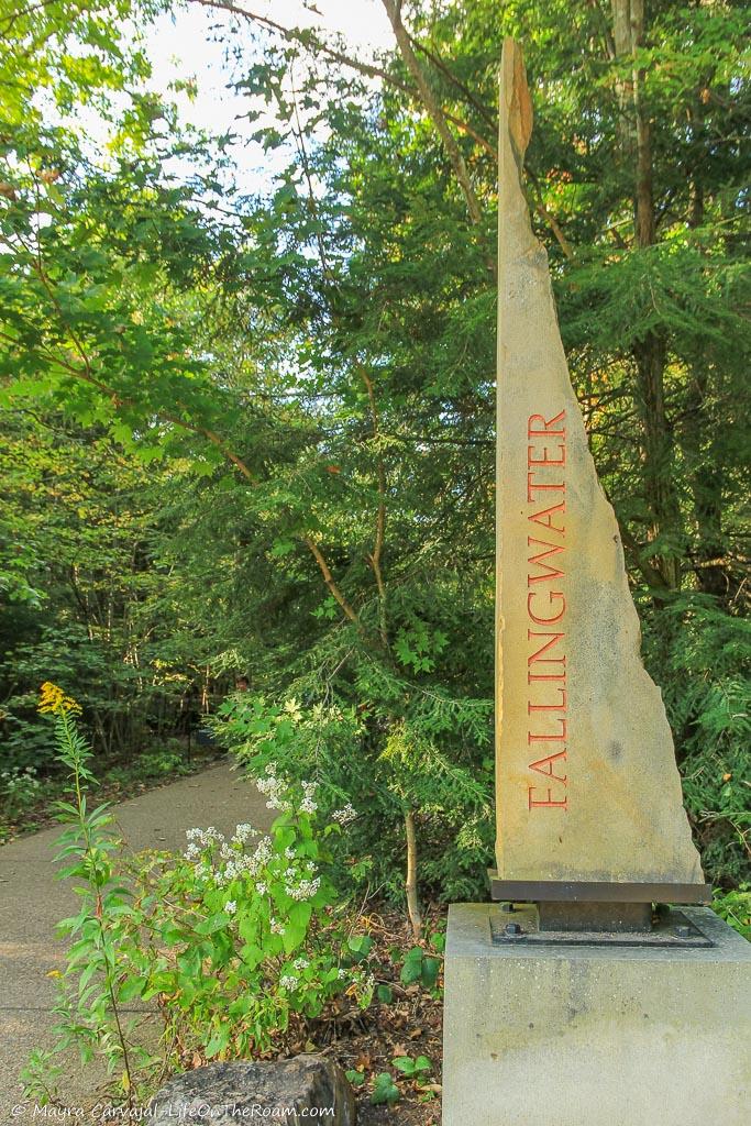 A vertical sign with the word "Fallingwater"