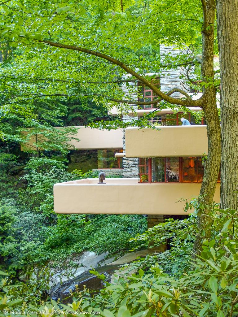 View of the cantilevered terraces of a house in a forest