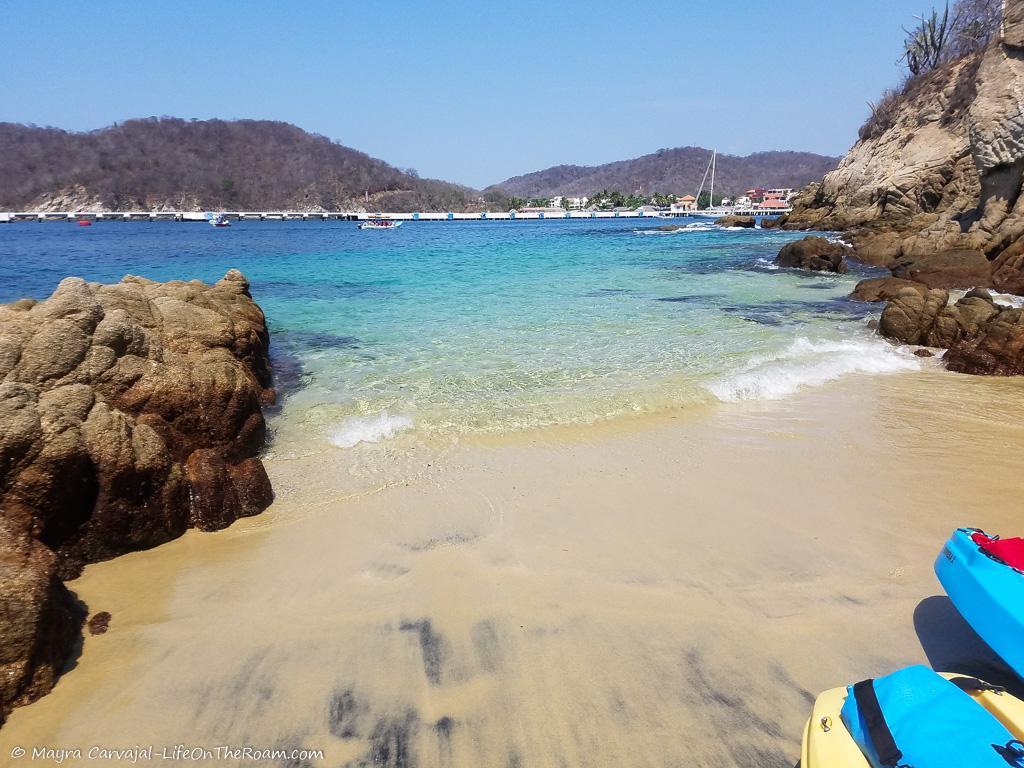 A sandy beach with turquoise waters