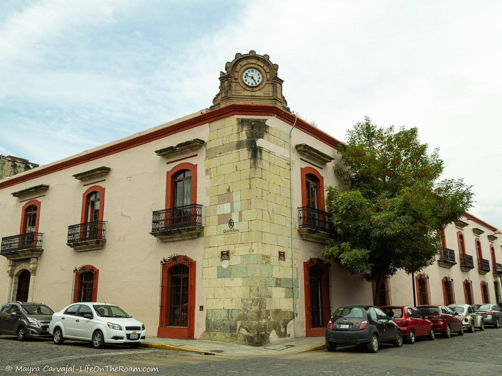 A corner building with a clock at the top