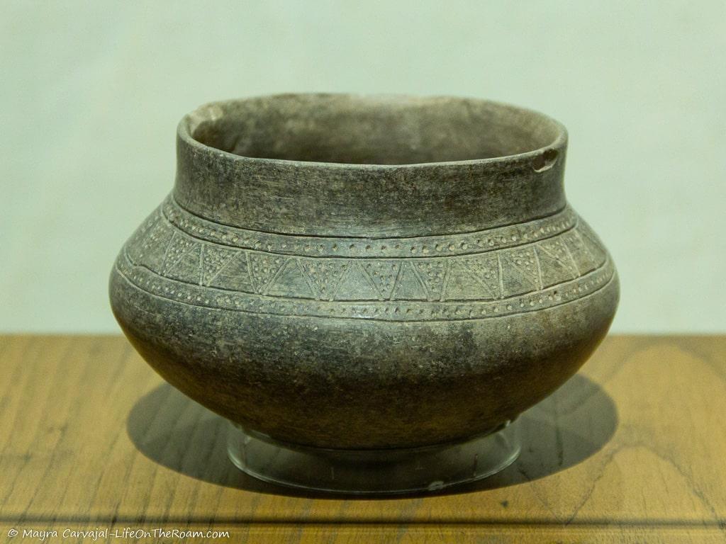 A pre-Columbian bowl made of clay with simple decoration