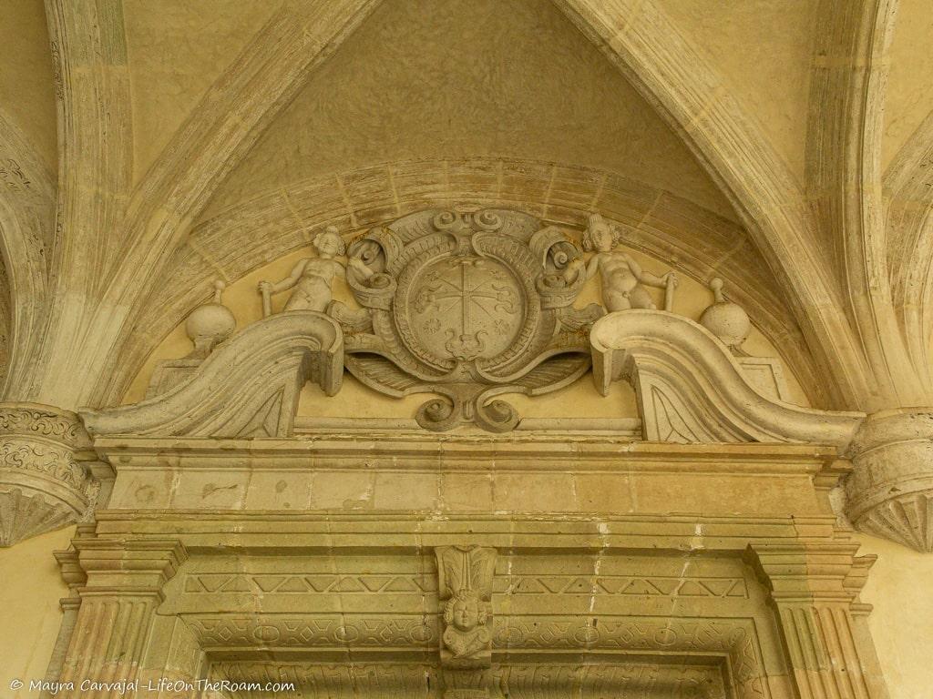 A decoration in stone above a door