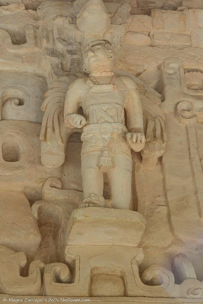 The sculpture of an ancient Mayan warrior