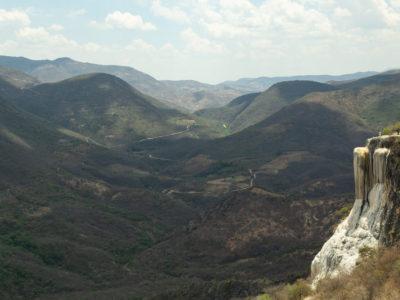 The sight of a petrified fall in the midst of a mountainous landscape