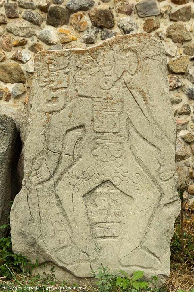 The figure of an ancient warrior carved in a stone