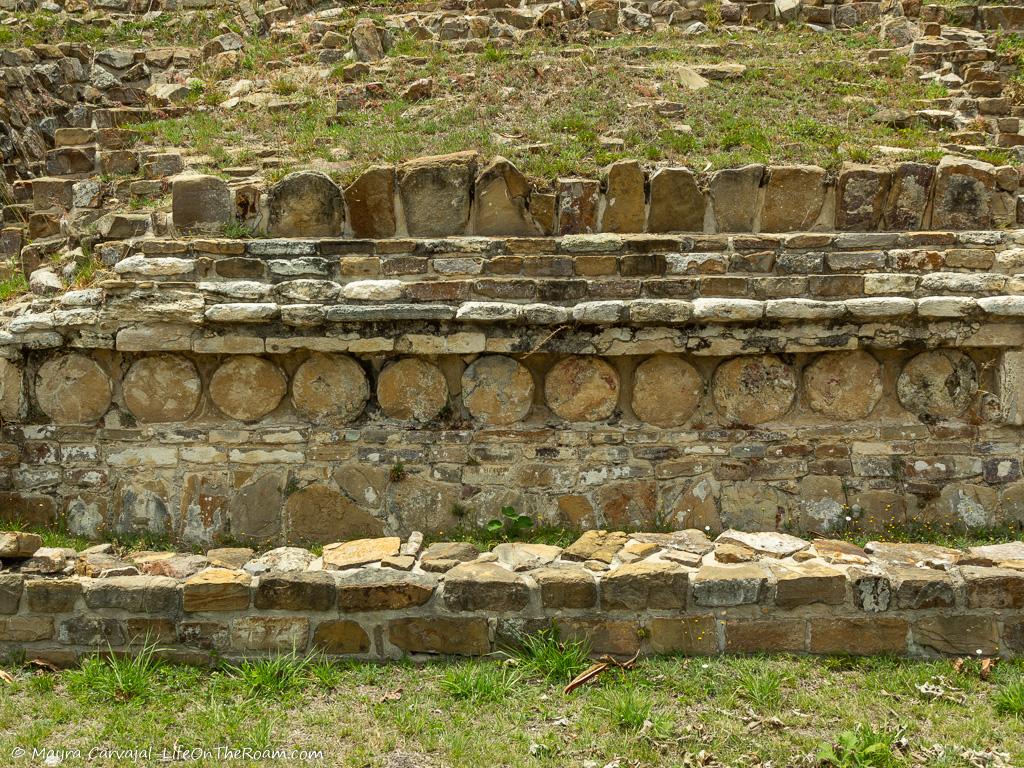 The vertical panel of an ancient temple decorated with circles