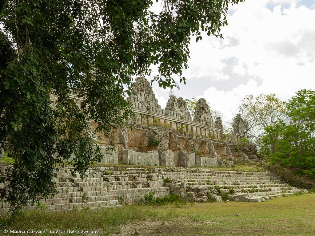 An ancient palace in stone with crest-like facade