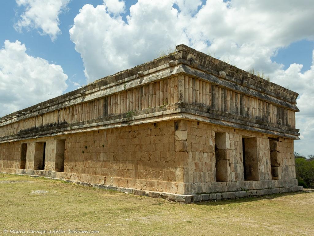 A rectangular building in an archeological site with colonnades