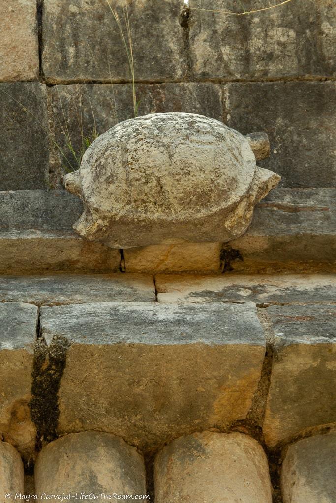 A stone carving in the shape of a turtle