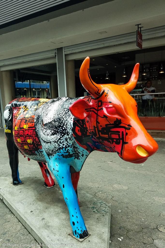 The colourful scupture of a cow
