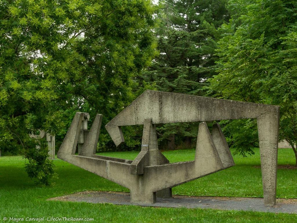 A concrete sculpture in a garden