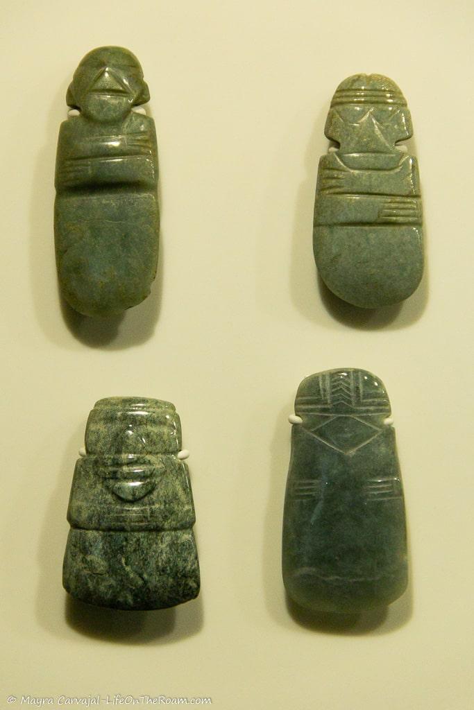 4 carved pieces of jade depicting people
