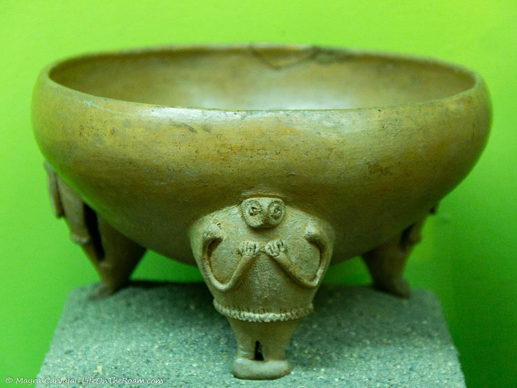 A bowl with anthropomorphic legs