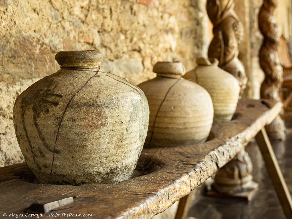 Pottery vases on a wood bench
