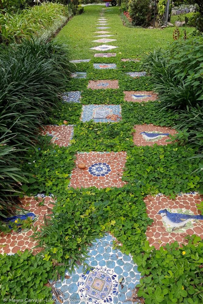 Colourful mosaic floor tiles  in a garden