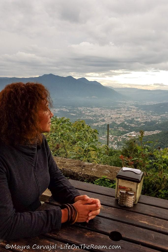 A woman looking at the mountain view