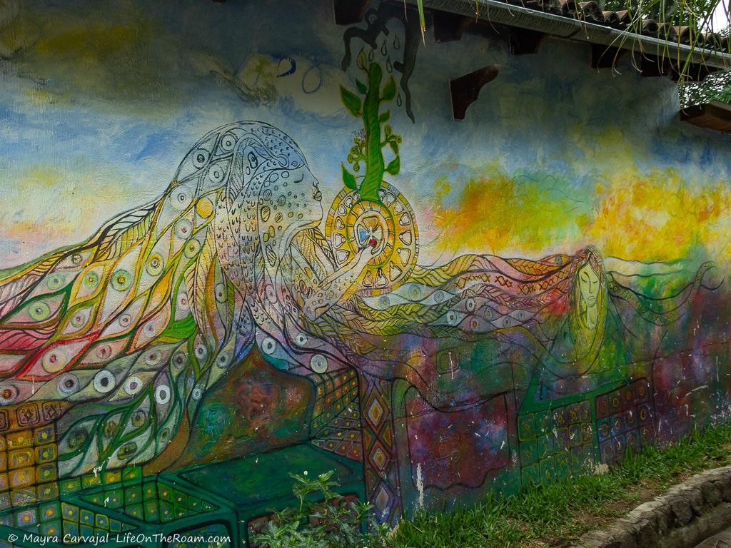 A colourful mural on a street with mystical themes