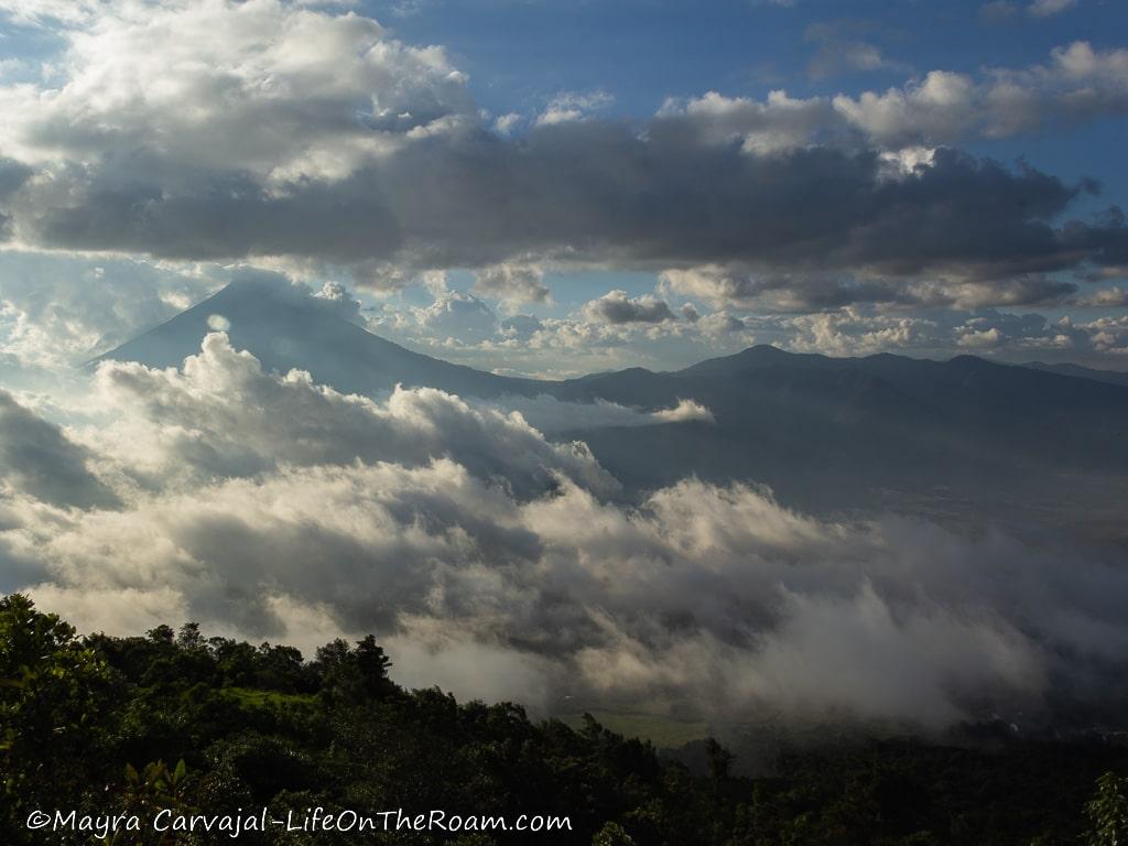 View of volcano peaks among the clouds