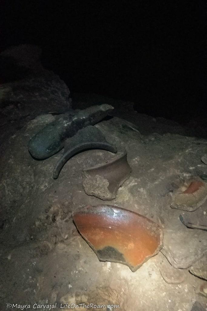 Ancient pottery inside a dark cave